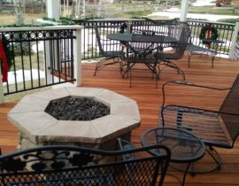 A stone firepit added to a custom redwood deck creates an intimate seating area.