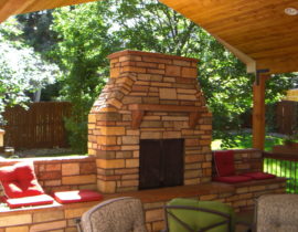 The homeowners built a gorgeous deck with cover but wanted to add a fireplace. We built a custom stone, wood-burning fireplace with mantle, hearth, and topper.