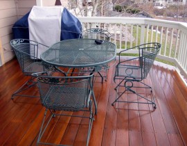 We built this deck using Brazilian Teak (also known as Cumaru) with a redwood snow fence railing and drink cap that are stained in white for a beautiful contrast.