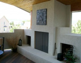 The homeowners built the covered deck of their dreams and had us add a custom designed stucco, wood-burning fireplace with a hearth and storage areas for wood.