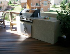 Working with the homeowners we designed and built a stucco grill/cooking area for their deck. A large countertop and storage cabinet make it very functional for the homeowners.