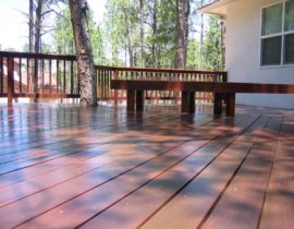 This hardwood deck was built using IPE, a Brazilian hardwood that is naturally mold, pest, and water-resistant. We also added a snow fence railing and a custom-made bench.