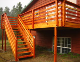 Redwood horizontal fence railing with drink cap.