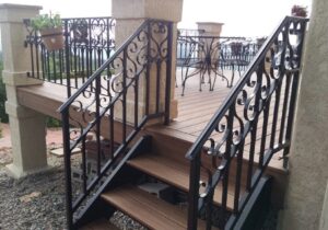 The homeowner designed the type of railing they wanted and we worked with a metal company to get it built in powder coated wrought iron.
