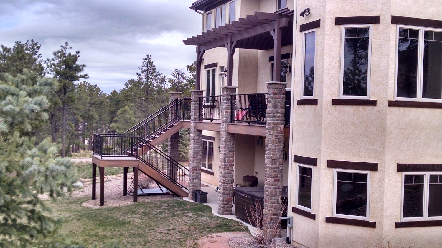Custom-built composite deck with wrought iron railing
