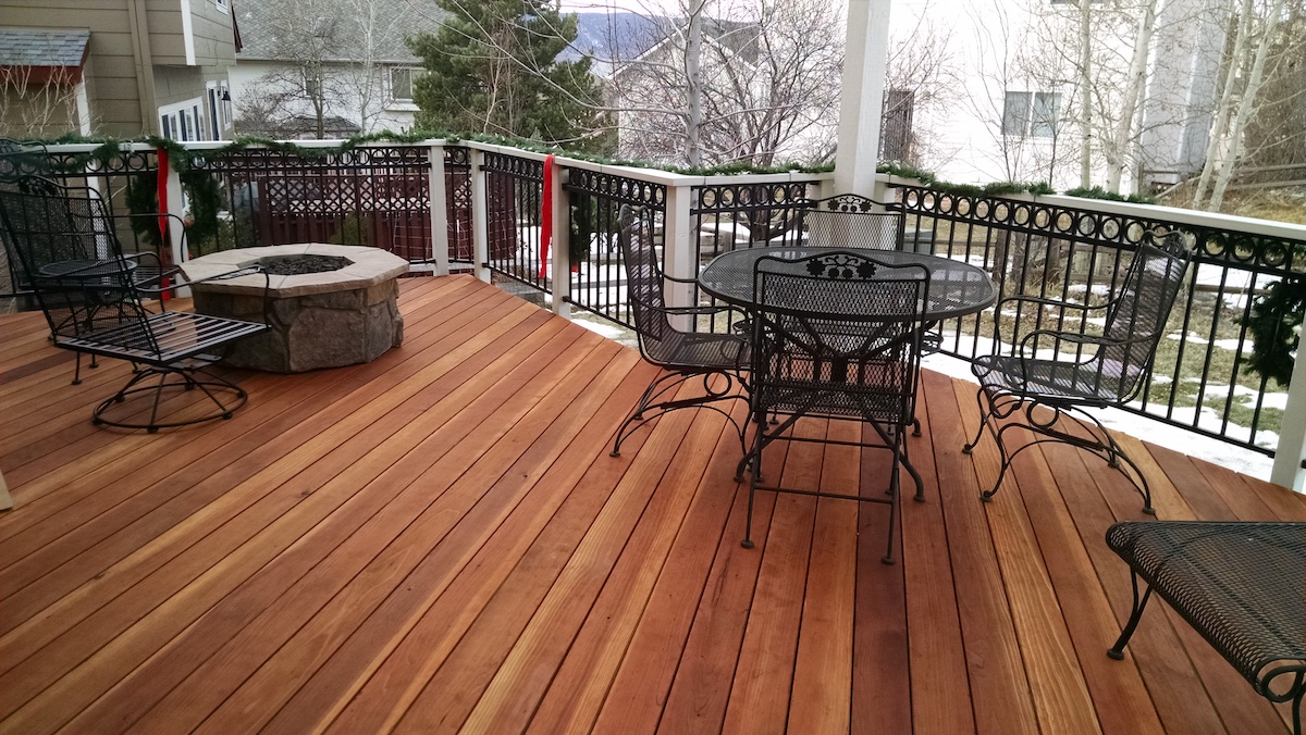 B grade redwood deck with metal panel railing, pergola, and fire pit