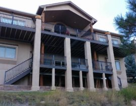 This project involved building two steel framed, elevated decks with stucco columns and the deck cover supported by large log beams.