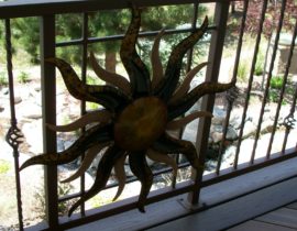 During their travels, the owners purchase a unique piece of metal art (a sun) that they wanted to incorporate into the railing. We designed a small section of the railing to support this sun design.