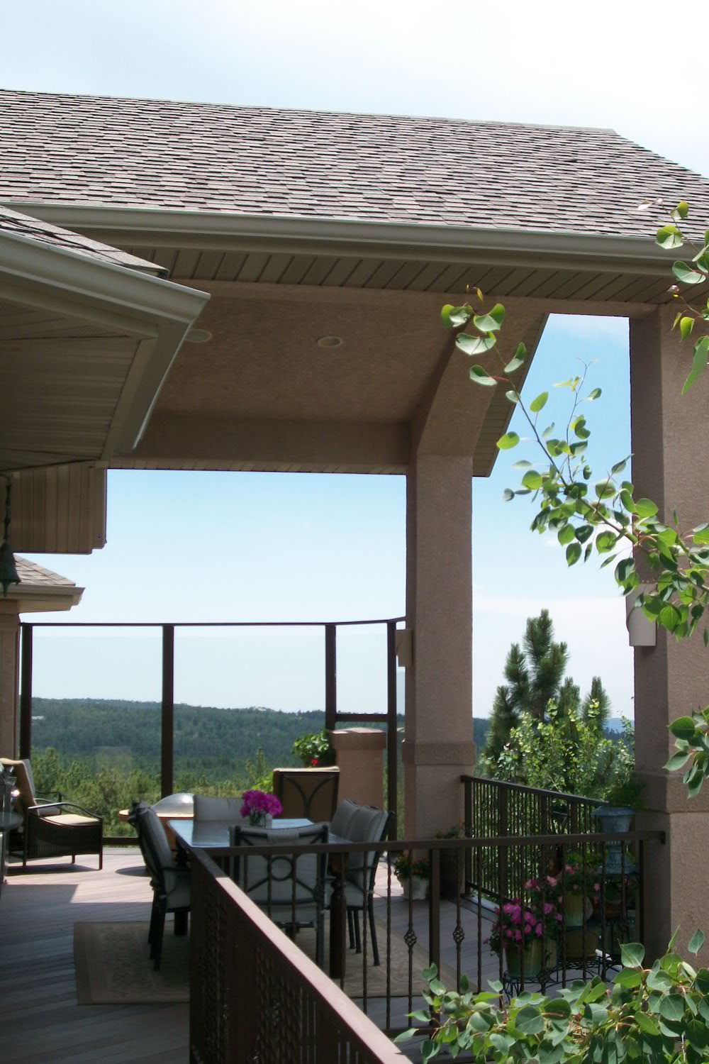 Gabled deck cover with vaulted ceiling in stucco.