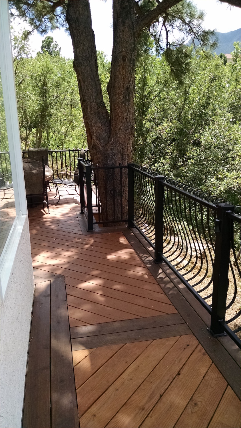 Custom Redwood deck, wrought iron deck railing, custom deck builders