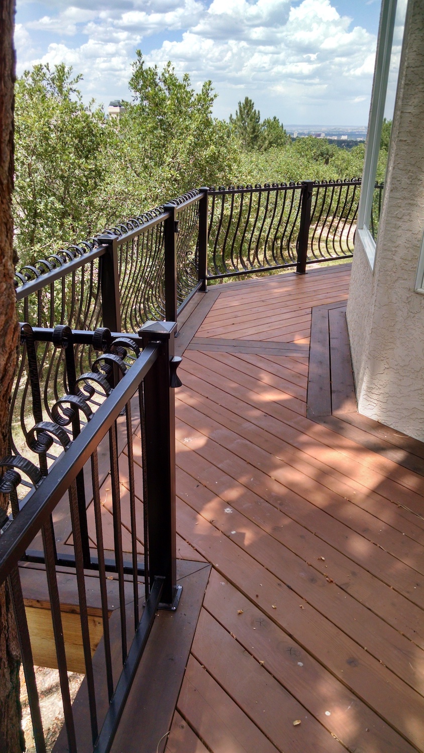 Herringbone deck design, Redwood deck, custom wrought iron railing, custom deck builders