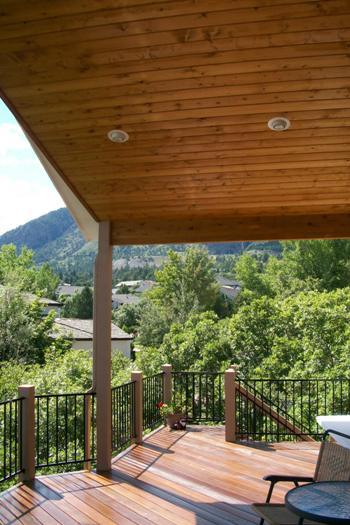 Hardwood deck with cover featuring vaulted tongue and groove knotty pine ceiling