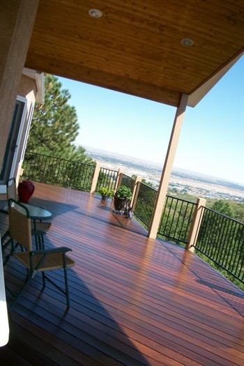 Custom hardwood deck in Brazilian redwood with gabled deck cover