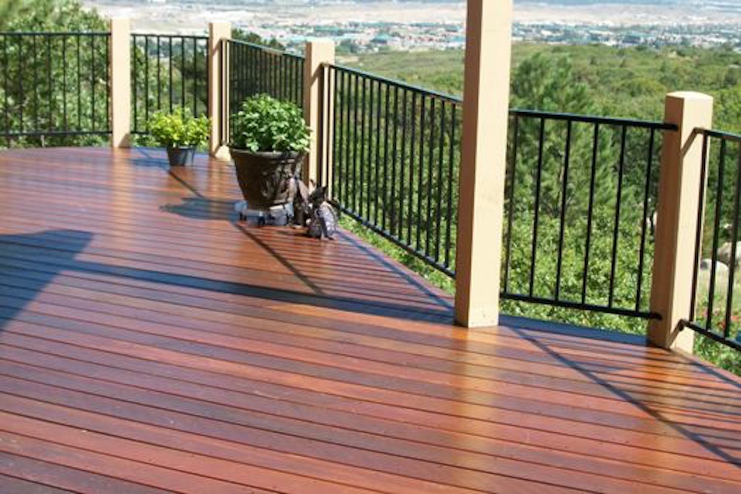 Brazilian Redwood custom deck with black metal railing.