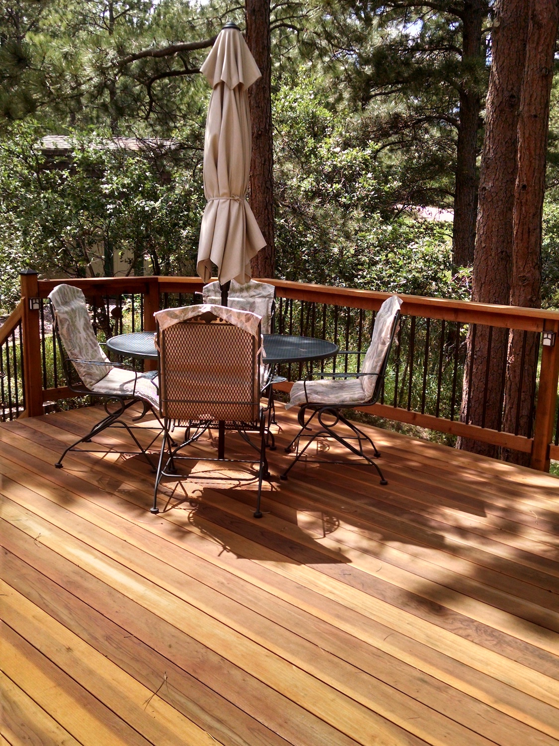 Redwood deck in the forest with a dinging area