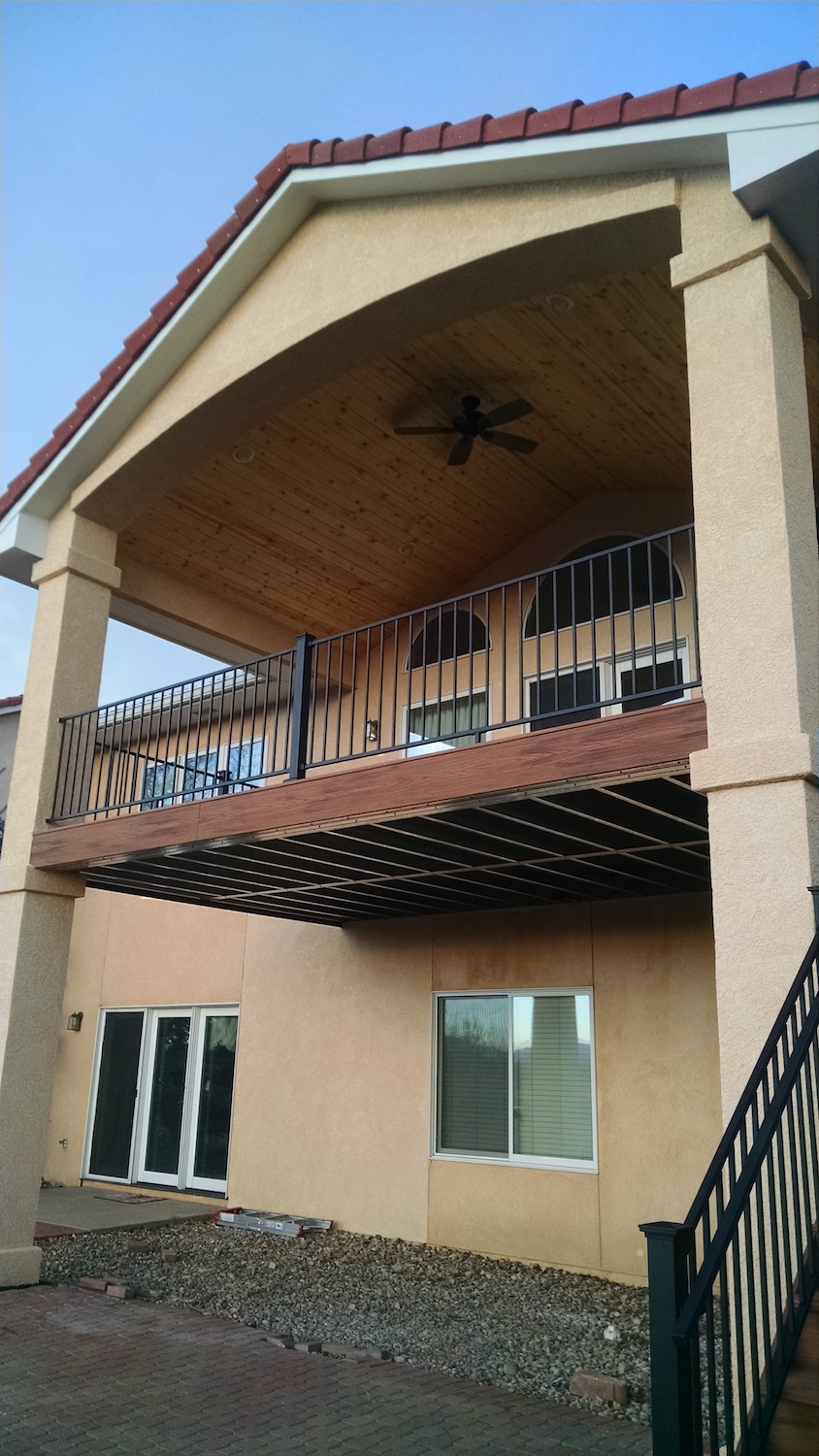 Steel deck framing supports an elevated composite deck with gabled deck cover