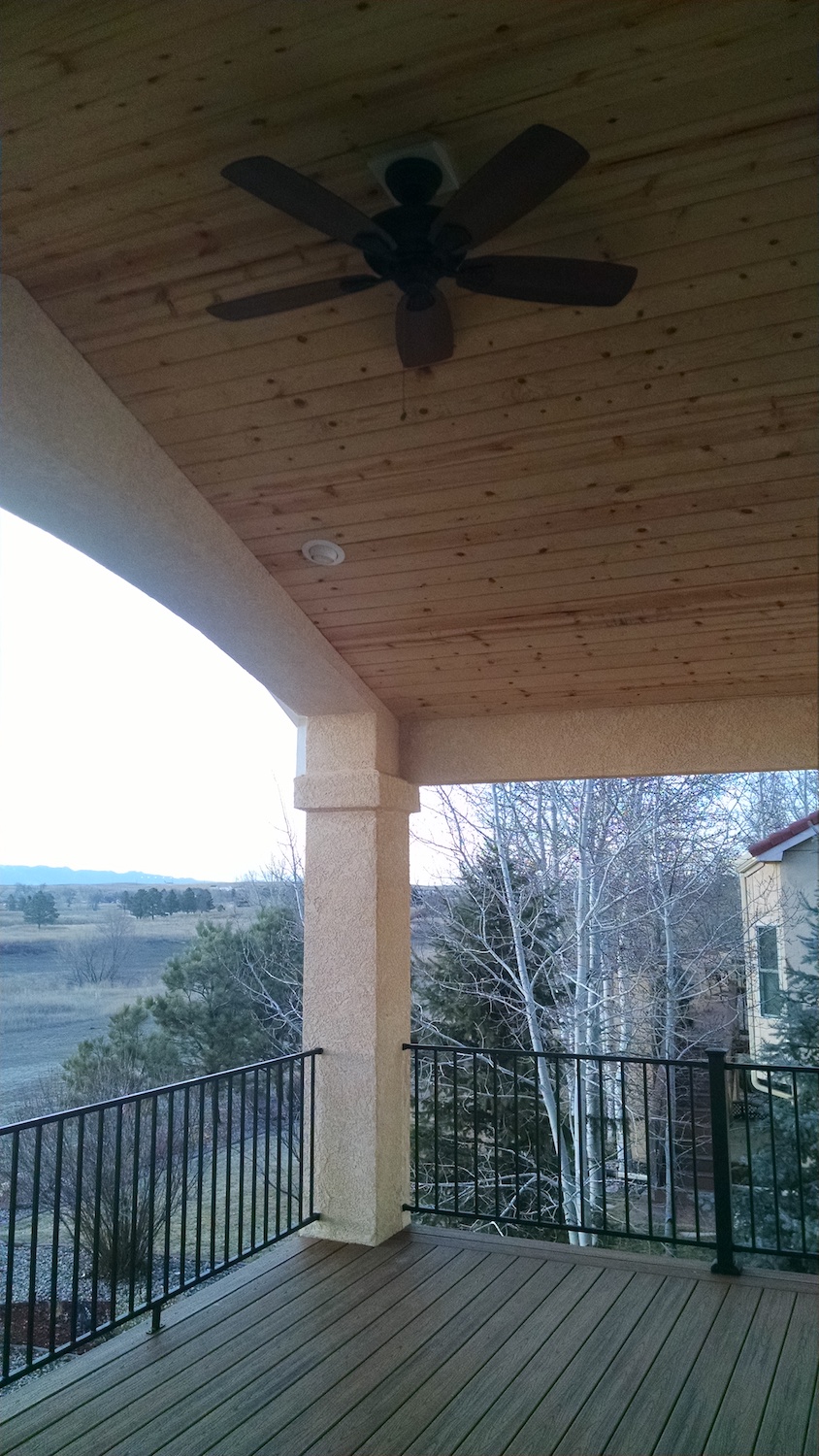 Deck cover with vaulted ceiling in tongue and groove knotty pine