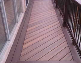 The homeowners decided to use composite decking laid out in a herringbone design. They also added a double picture frame in a contrasting color.