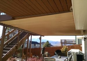 This dry space with metal ceiling was built in an accent color to the deck above.
