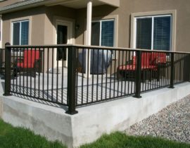This is a black, metal panel railing system with 3x3 posts and a composite drink cap