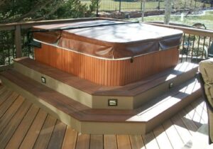 We built two wrap-around steps for a hot tub and installed Pikes Peak step lights. The lights are rectangular with a design that resembles the mountains and a sliver moon.