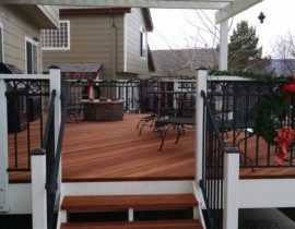 Custom redwood deck with wood and metal railing and Cedar pergola