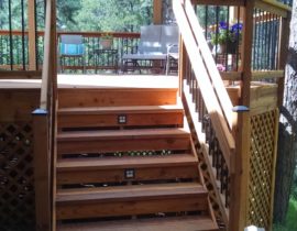 Redwood deck with pergola and wood and metal railing