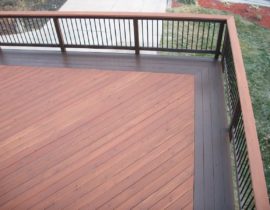 This deck has 45-degree angled boards and a railing drink cap that have been stained with a Level 2. A quadruple picture frame and the railing have been stained in a contrasting Level 3 stain.