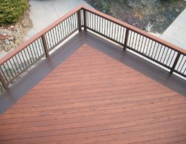 This Redwood deck features decking laid at 45-degrees and a quadruple picture frame stained in a contrasting color.