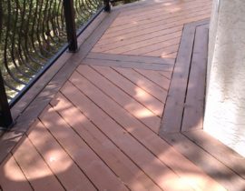 Heart Redwood decking in a herringbone design with double picture frame in a contrasting stain color