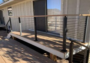 ViewRail railing system consisting of metal posts and horizontal, steel cables.