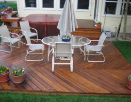 Ground level Cedar deck with the boards laid out in a herringbone design
