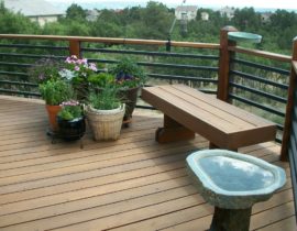 A Redwood deck, bench, and railing all stained in a Level 2 stain.