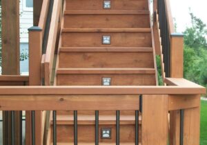 The Moab deck stair light is a square divided in half top to bottom, then the top portion is halved right to left.