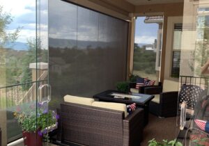 Pull down shades added to glass walls to keep it cool