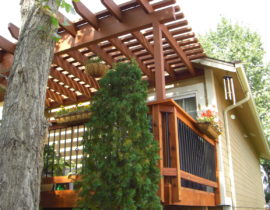 Redwood deck with wood and metal railing, and cedar pergola