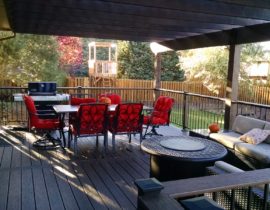 We built this deck with decking laid at 90-degrees and single divider board. The railing has composite posts and drink cap with metal railing panels. We also built a cedar pergola to provide shade for the homeowners.