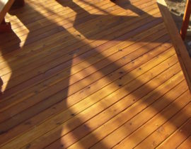 This cedar deck was laid out with the boards at 45-degrees and features custom built benches for seating.