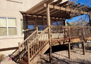 This redwood deck was built with a snow fence railing and Douglas Fir pergola. The decking is stained with Tahoe Teak in a semi-transparent. The pergola, railing, and fascia are all stained with a solid stain - PPG Butternut.