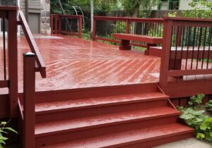 This is a heart redwood deck that was built to replace a smaller existing deck in the historic district of Colorado Springs. It features 6'-wide stairs and a wood railing with round metal balusters.