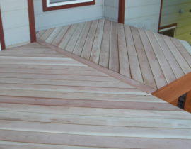 This is a B-grade redwood deck with herringbone design. It shows the deck before we have installed the railing or stained the decking.