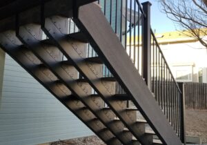 Deck and stair case that were framed in a powder coated, galvanized, steel deck frame.