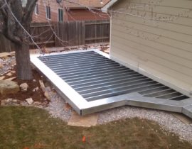 Ground level custom deck with steel deck framing