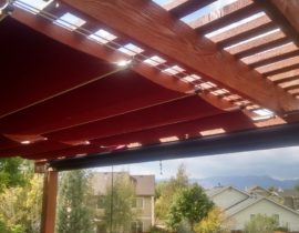 This cedar pergola features drop down shades on the front side. Under the top of the pergola we installed sliding shades to protect against the sun.