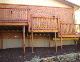 This multi-level deck features a snowfence on each level with the balusters mounted on the outside.