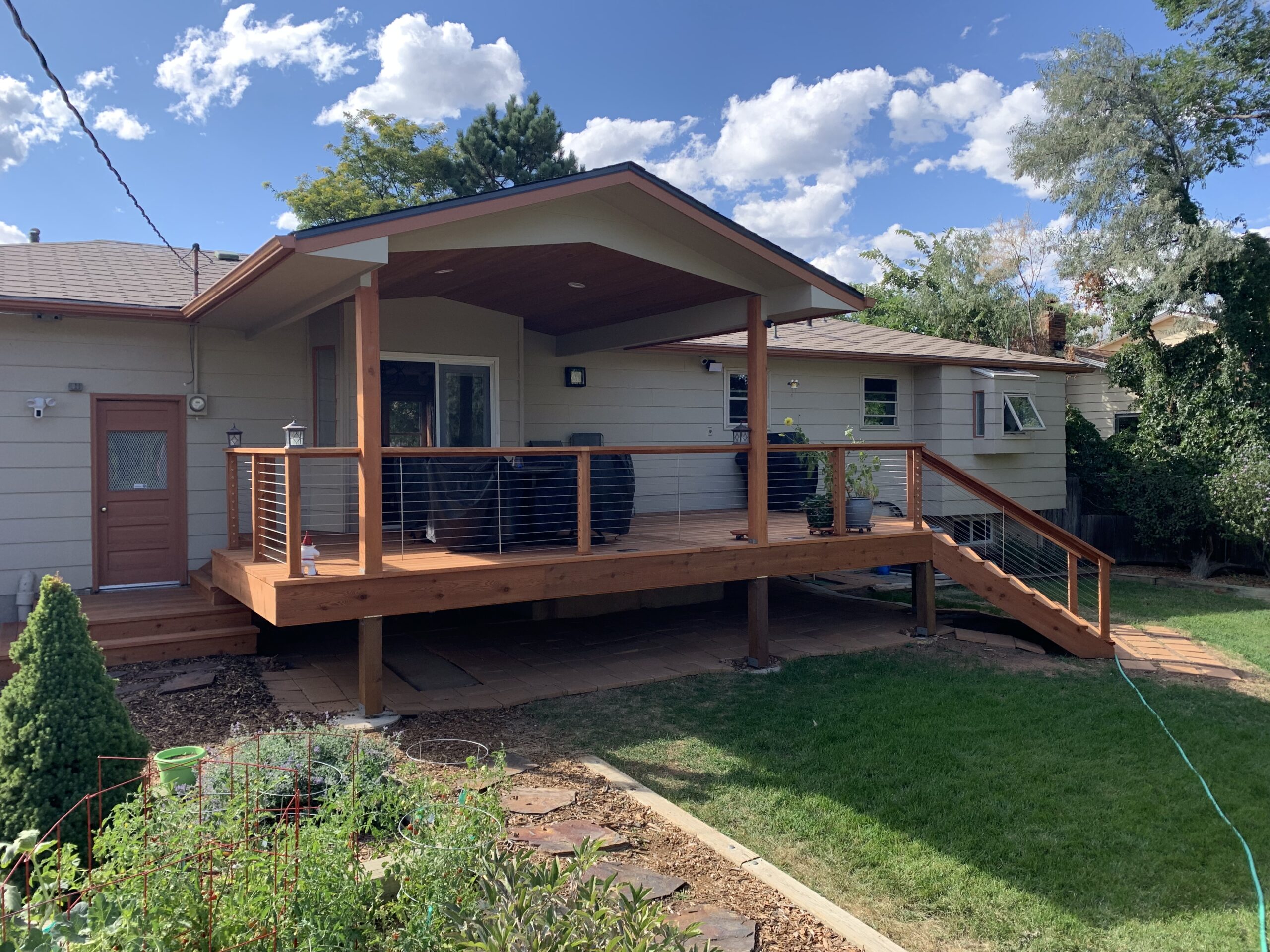 B-Grade Redwood deck with a gabled deck cover and custom designed railing
