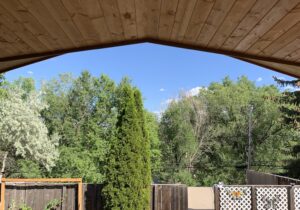 The deck cover features a beautiful tongue and groove pine, vaulted ceiling