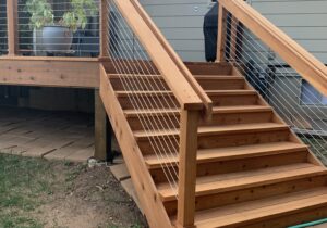 6'-wide closed deck stairs with the wood and stainless steel cable railing.