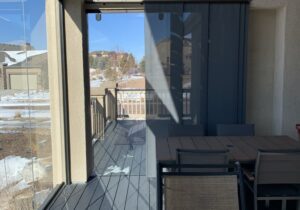 A sliding glass door was installed at one end of the 3 season room to provide access to the rest of the deck