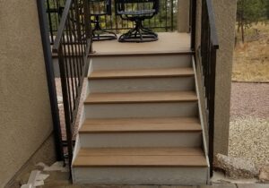 Closed deck stairs with metal panel railing